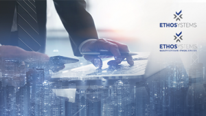 buildings with overlay of hands typing on laptop