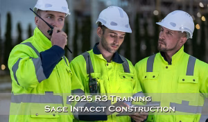 three construction men looking at an ipad