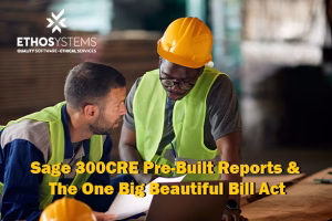 two builders working on a computer