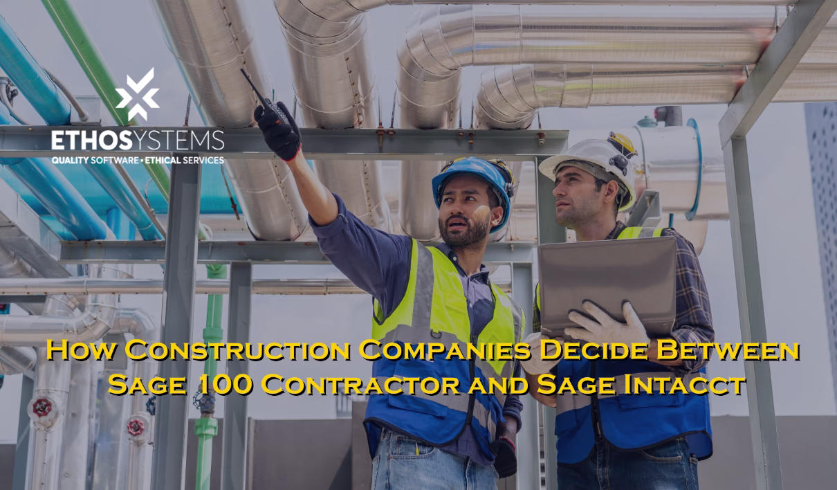 two construction workers with a computer on site