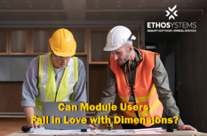 two construction men looking at a computer and plans