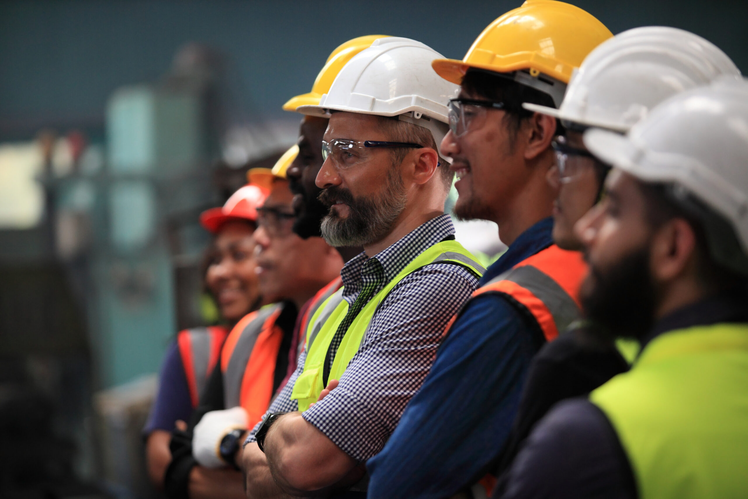 Row of construction workers looking to the side