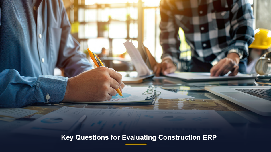 Contractor reviewing job cost and financial reports while evaluating construction ERP software