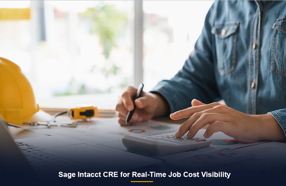 Contractor manually calculating job costs — the process a cloud construction ERP replaces with real-time visibility.
